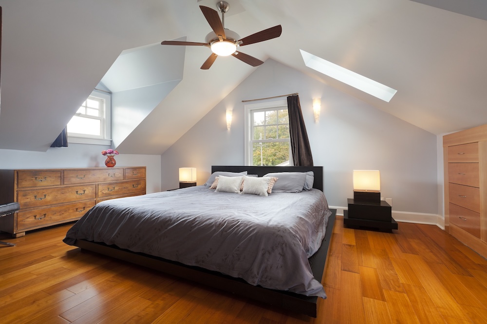 Grand bedroom in large attic space.